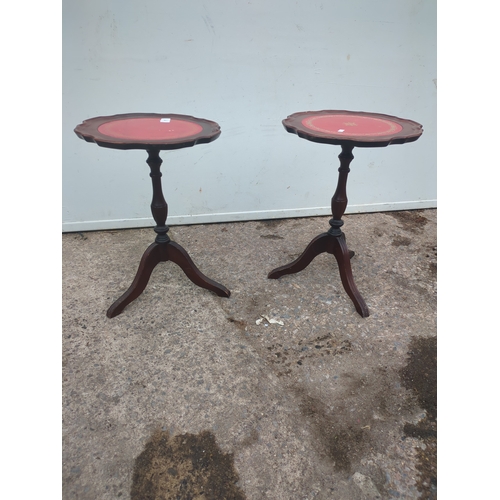 683 - A pair of leather topped mahogany side tables