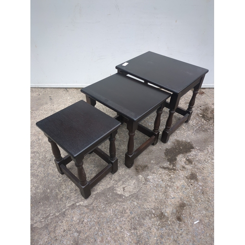 685 - A nest of 3 oak tables