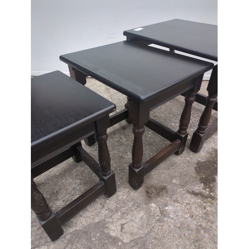 685 - A nest of 3 oak tables