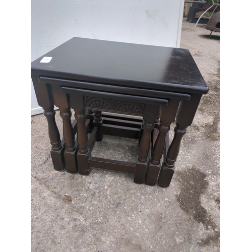 685 - A nest of 3 oak tables