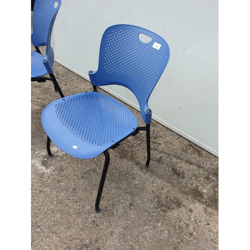 298 - A pair of retro Herman Miller blue office chairs