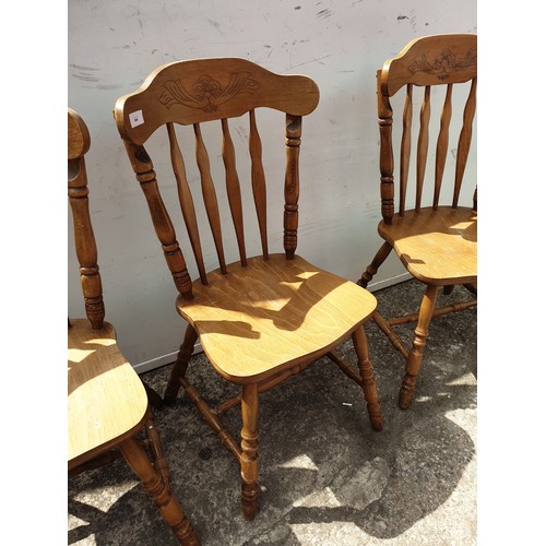 698 - A set of 4 farmhouse style pine dining chairs