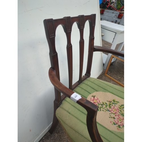 420 - A Victorian mahogany framed hall chair with an embroidered seat base