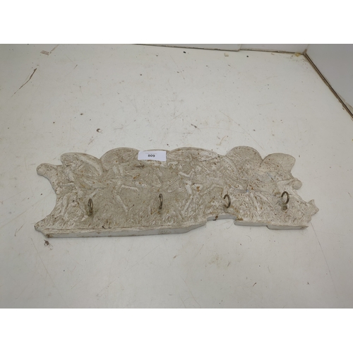 809 - A plaster coat hanger