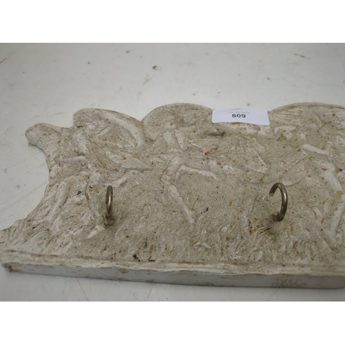 809 - A plaster coat hanger