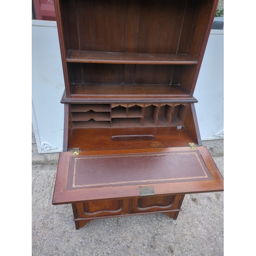 474 - An antique mahogany bureau with shelving unit