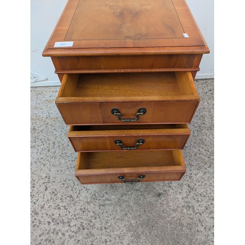 477 - A vintage 3 drawer bedside table