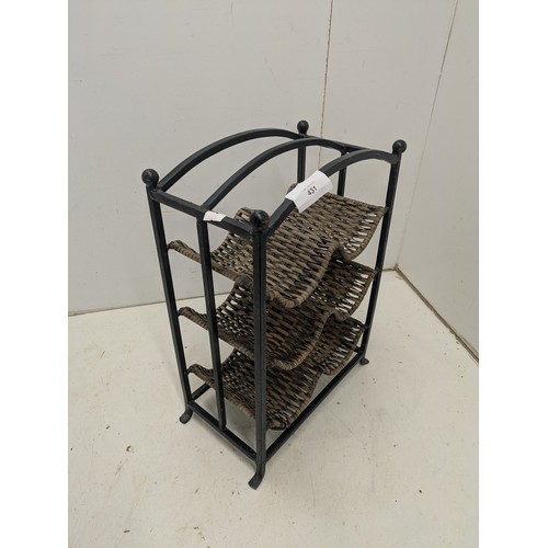 479 - A wrought iron and wicker 6 bottle wine rack