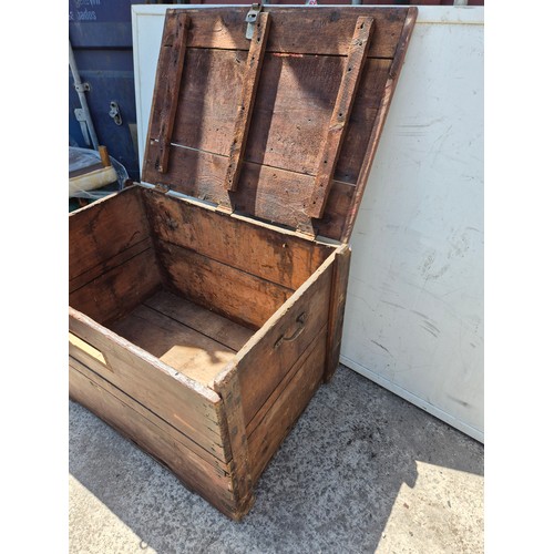 480 - A large vintage pine storage trunk