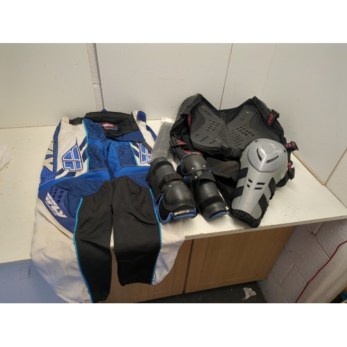 A complete Motocross body armor and protection including fly racing ...
