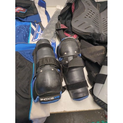A complete Motocross body armor and protection including fly racing ...