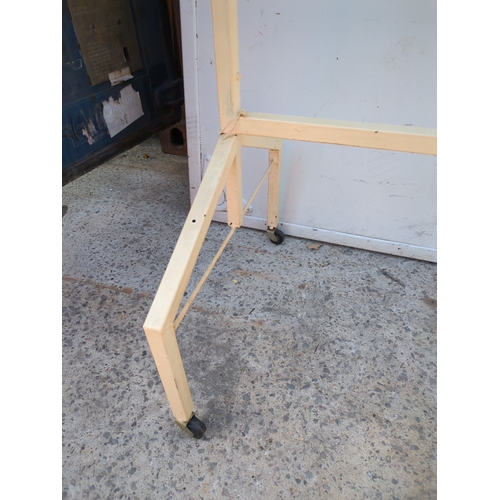 27 - A retro angular clothes rail on casters