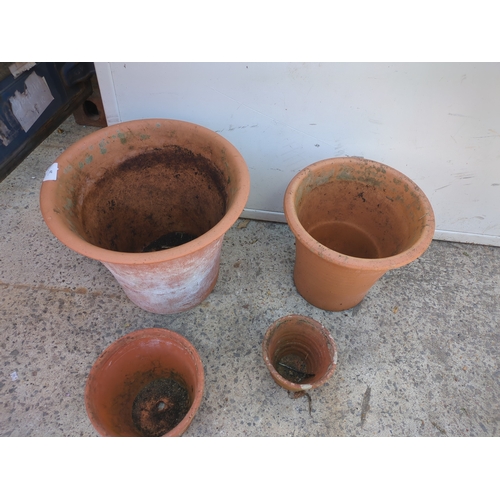 29 - A quantity of graduating terracotta pots