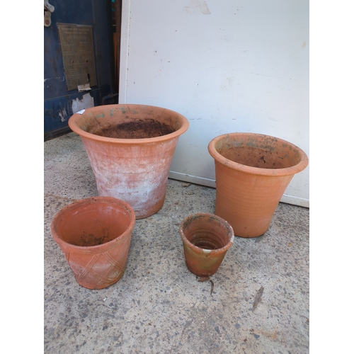 29 - A quantity of graduating terracotta pots