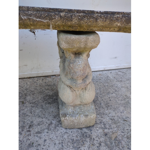 33 - A concrete curved garden bench