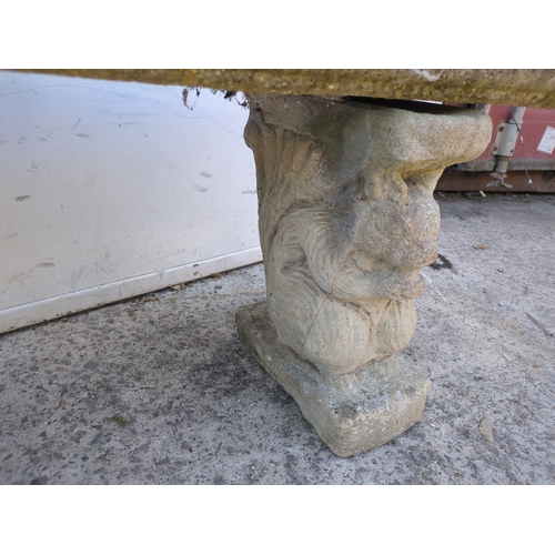 33 - A concrete curved garden bench