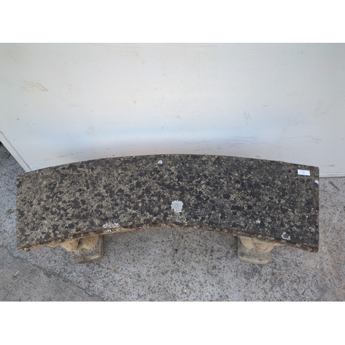 33 - A concrete curved garden bench