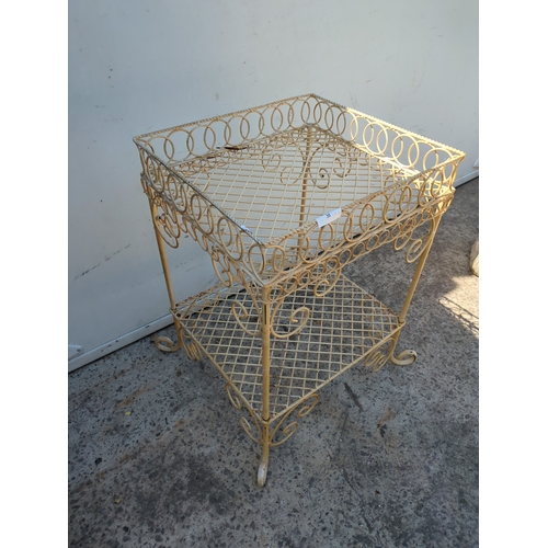 35 - A wrought iron wheeled trolley