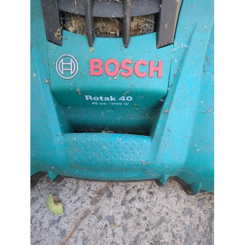 36 - A Bosch corded lawn mower - working