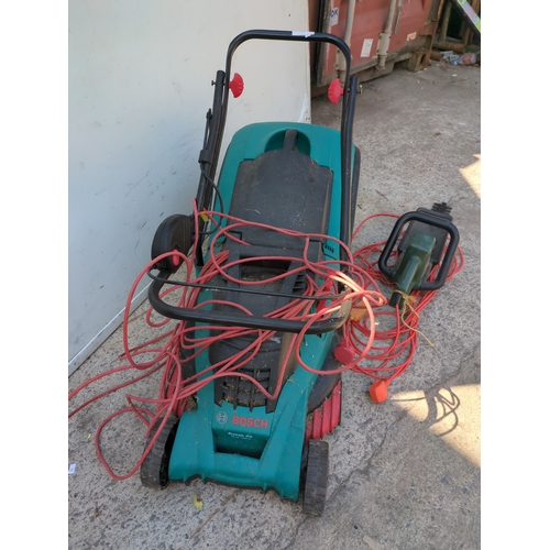 36 - A Bosch corded lawn mower - working