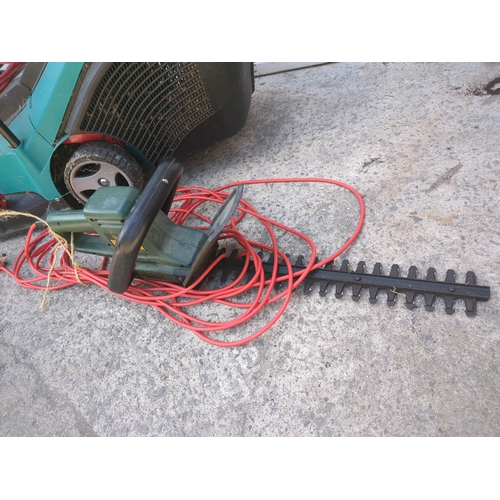36 - A Bosch corded lawn mower - working
