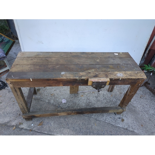 19 - A vintage pine workbench with vise