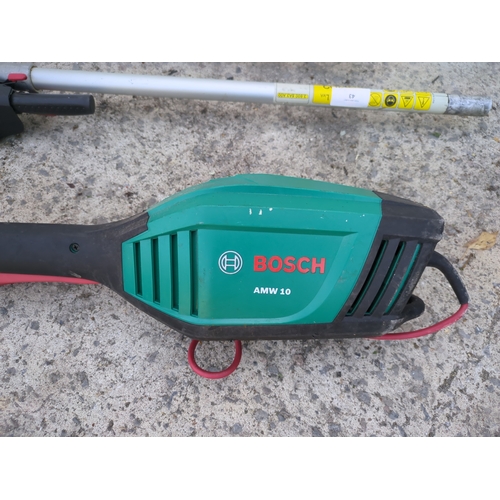 43 - A Bosch corded pole chainsaw and hedge trimmer - working