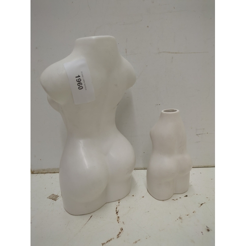 2201 - A pair of carved model vases