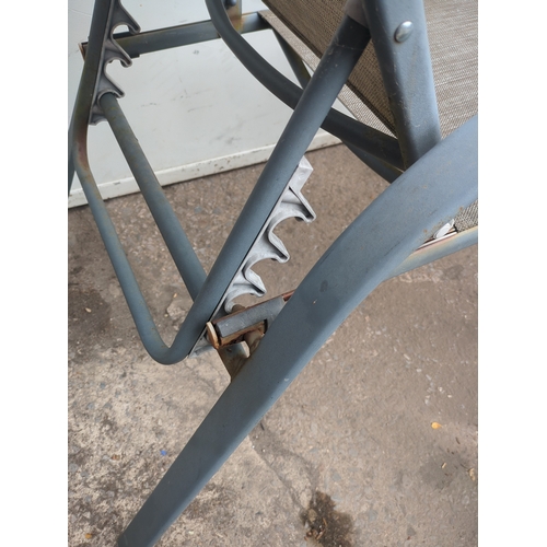 224 - Pair of Metal Outdoor Chairs with Mesh Seating and matching foot stools