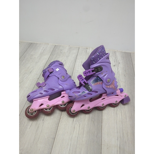 21 - Selection of rollerblades and protective pads