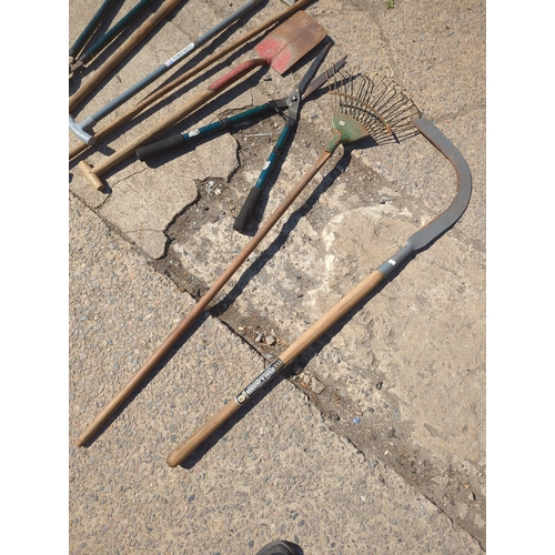 23 - Lot of Garden Tools including Rakes and Spades