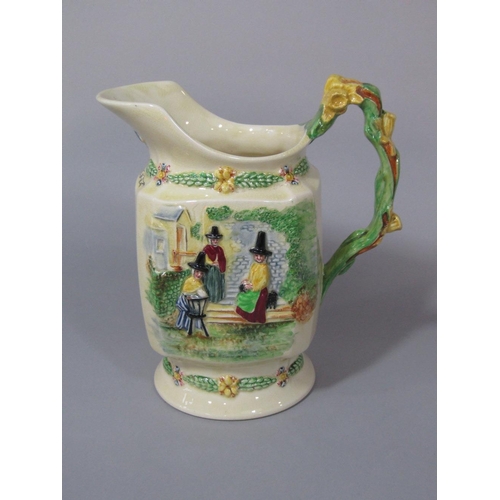 100 - A Fieldings Crown Devon musical jug,with relief moulded figures of Welsh characters and Welsh poem,L... 