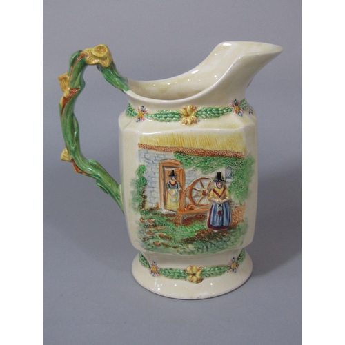 100 - A Fieldings Crown Devon musical jug,with relief moulded figures of Welsh characters and Welsh poem,L... 