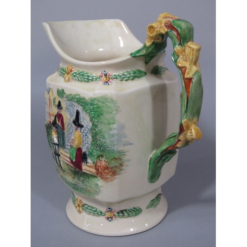 100 - A Fieldings Crown Devon musical jug,with relief moulded figures of Welsh characters and Welsh poem,L... 