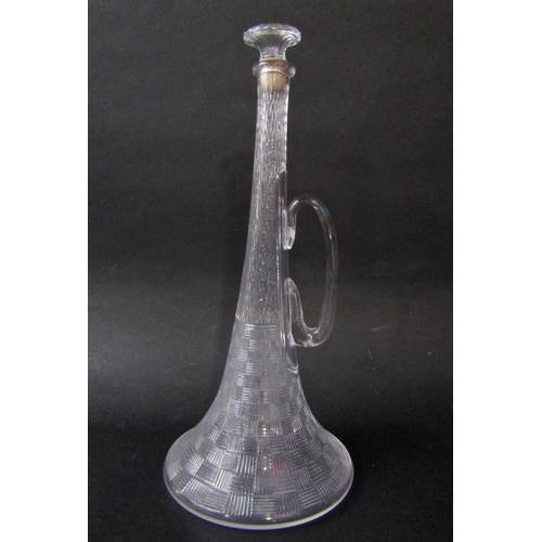 125 - Novelty glass decanter in the form of a trumpet,with parquet type engraved decoration,55cm high