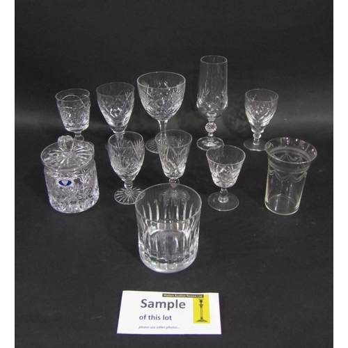 128 - A mixed collection of cut and cranberry glassware to include various wine and sherry glasses,tumbler... 