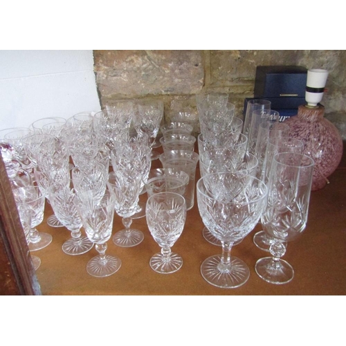 128 - A mixed collection of cut and cranberry glassware to include various wine and sherry glasses,tumbler... 