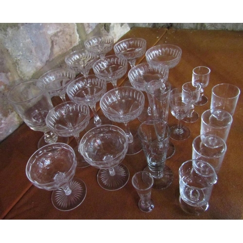 129 - Set of ten cut glass champagnes of elegant form,together with two further star cut champagnes and va... 