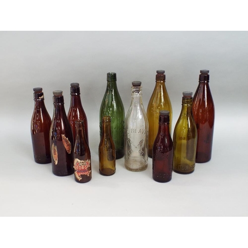 130 - A collection of antique advertising/beer bottles,many of local interest (11)