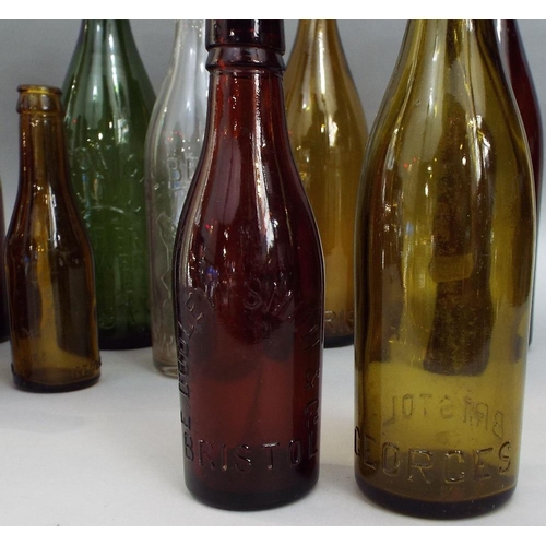 130 - A collection of antique advertising/beer bottles,many of local interest (11)