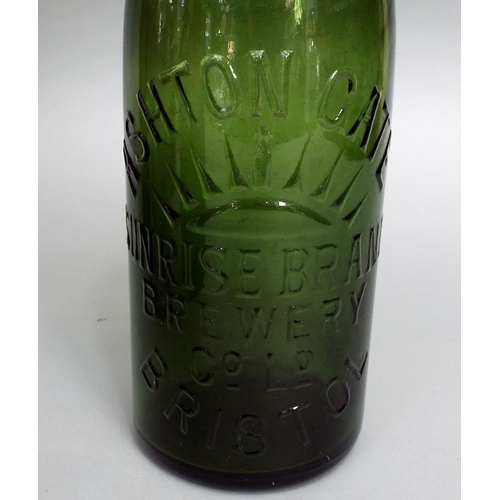 130 - A collection of antique advertising/beer bottles,many of local interest (11)