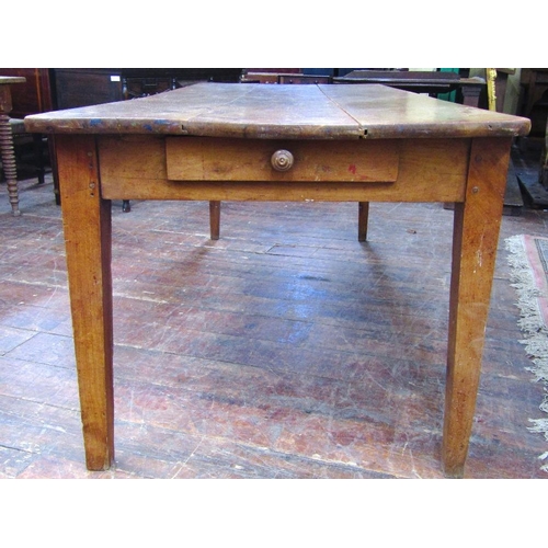 1510 - An early 19th century fruitwood dining table the heavy plank top raised on four square taper support... 