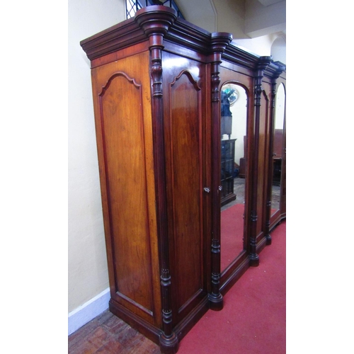 1516 - Good quality Victorian breakfront triple wardrobe,the central mirror panelled door enclosing a tower... 