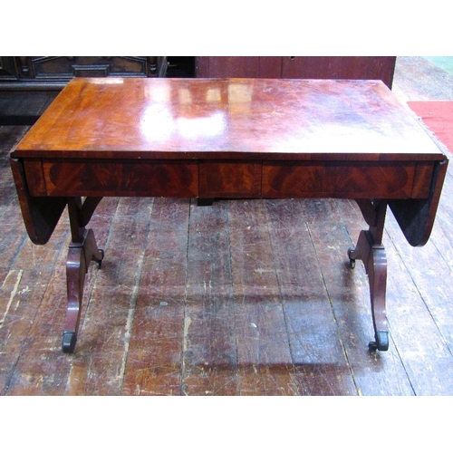 1518 - A 19th century mahogany sofa table with cross banded detail and flame veneers fitted with two frieze... 