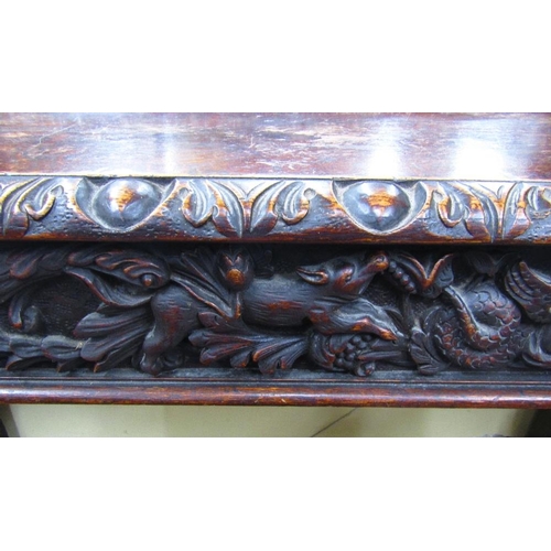 1521 - A remarkable Victorian carved oak pedestal sideboard with inverted breakfront form set beneath large... 