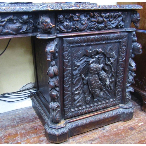 1521 - A remarkable Victorian carved oak pedestal sideboard with inverted breakfront form set beneath large... 