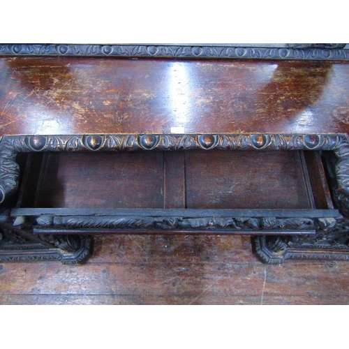 1521 - A remarkable Victorian carved oak pedestal sideboard with inverted breakfront form set beneath large... 