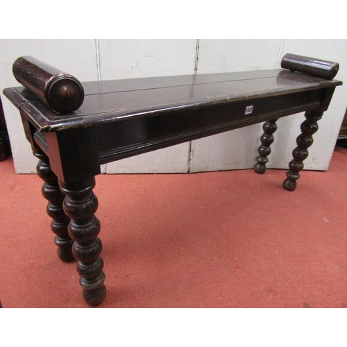 1523 - A Victorian oak window seat of rectangular form on bobbin supports,107 cm length