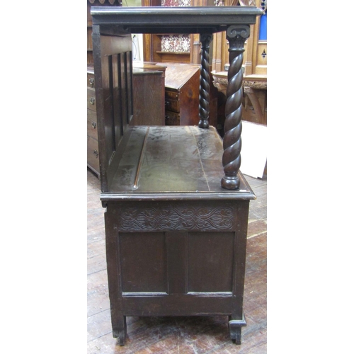 1527 - An old English oak buffet,the lower section enclosed by two doors with repeating carved floral and g... 