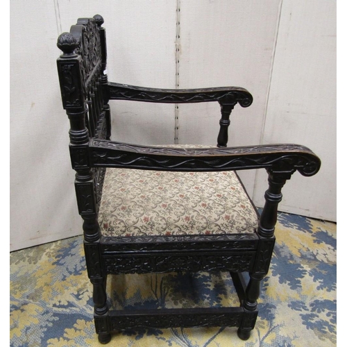 1528 - A good quality 19th century Indian ebonised hardwood elbow chair with drop in seat,profusely carved ... 